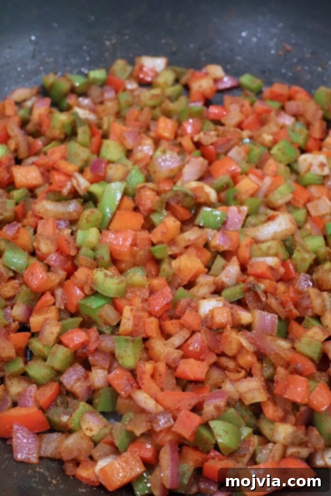 Sizzling Fajita Seven-Layer Dip 4 Fajita seasoned diced peppers and onions sizzling in a skillet