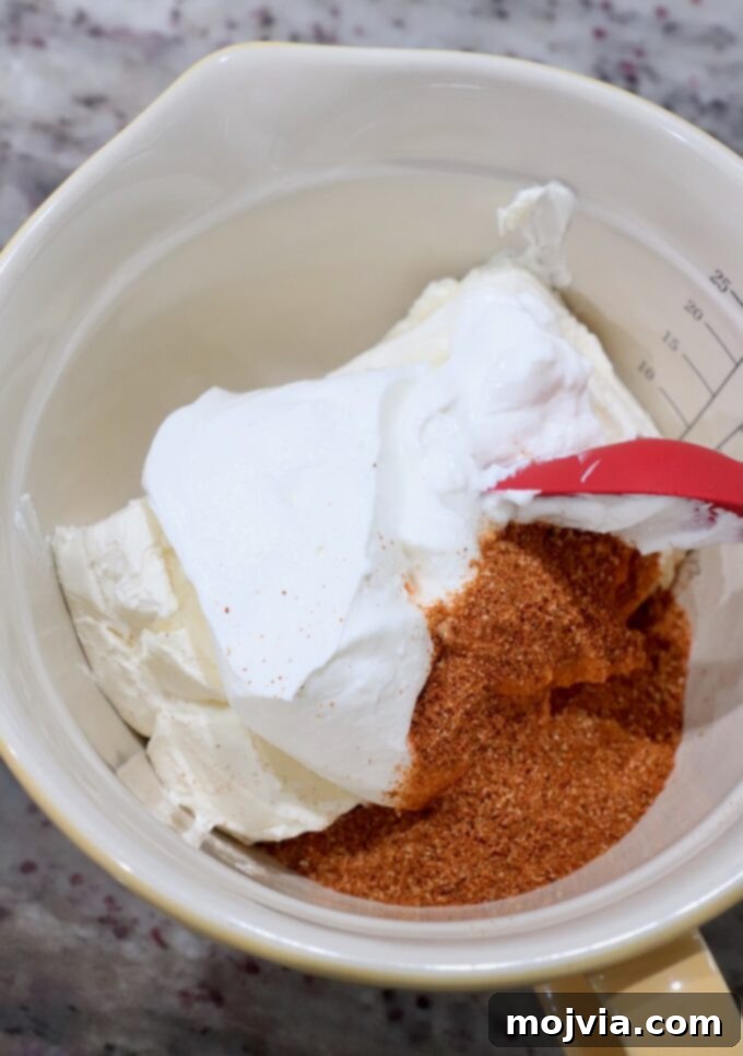 Sizzling Fajita Seven-Layer Dip 5 Cream cheese, sour cream, and fajita seasoning mixed in a bowl