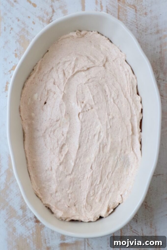Sizzling Fajita Seven-Layer Dip 7 Fajita seasoned cream cheese mixture layered in a casserole dish