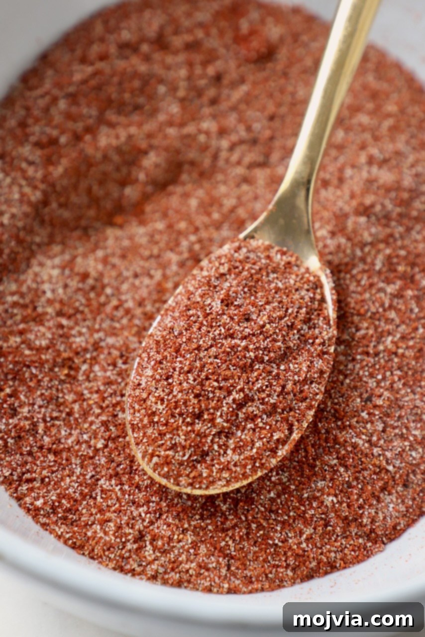 chicken wing dry rub in bowl with gold spoon