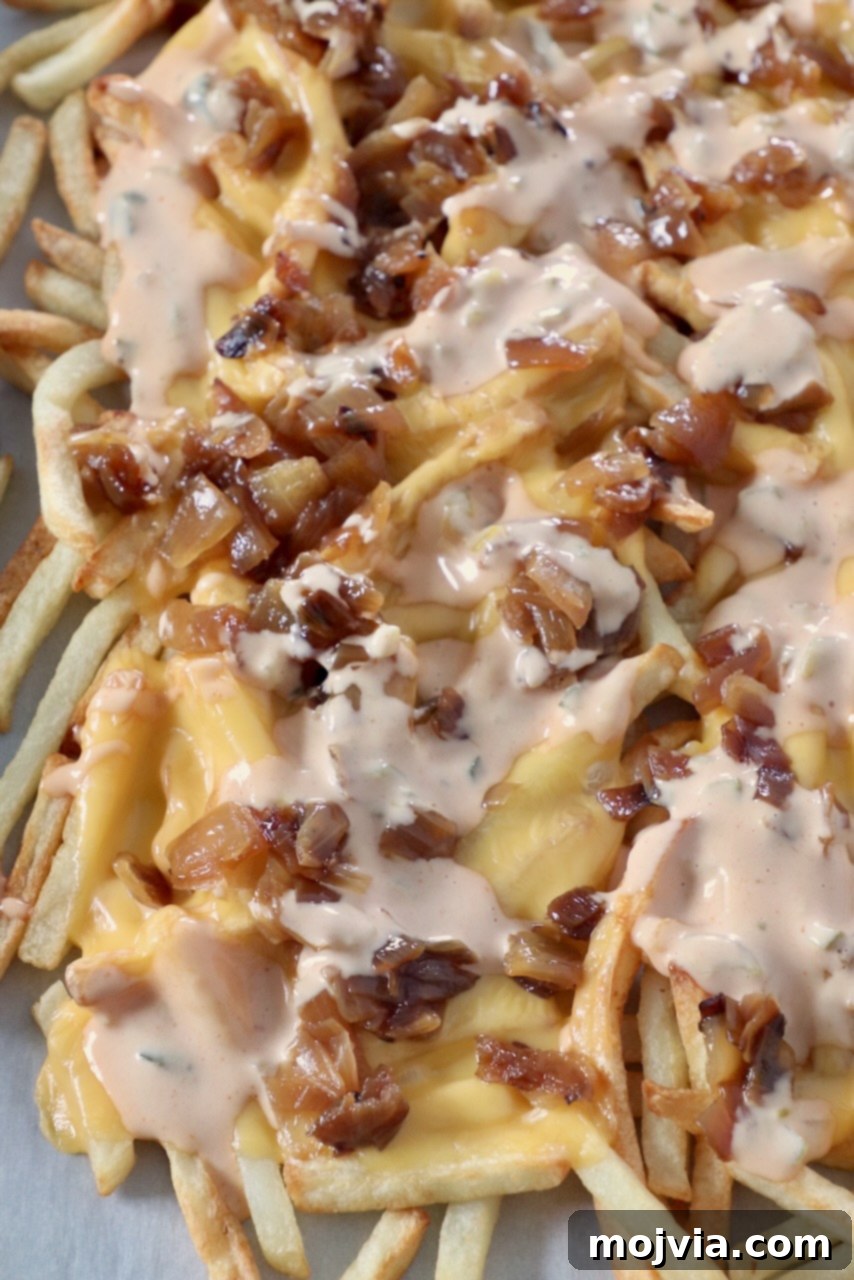 Secret Sauce Loaded Fries 6 animal style fries on parchment-lined baking sheet