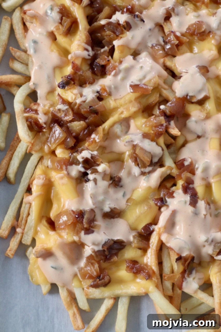 Secret Sauce Loaded Fries 7 animal style fries on parchment lined baking sheet