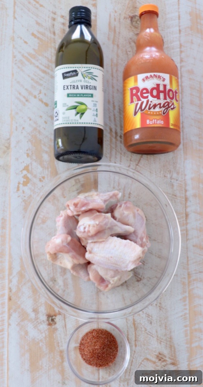 Sous Vide Wings: Crispy, Juicy Perfection 3 ingredients for buffalo chicken wings on wood board