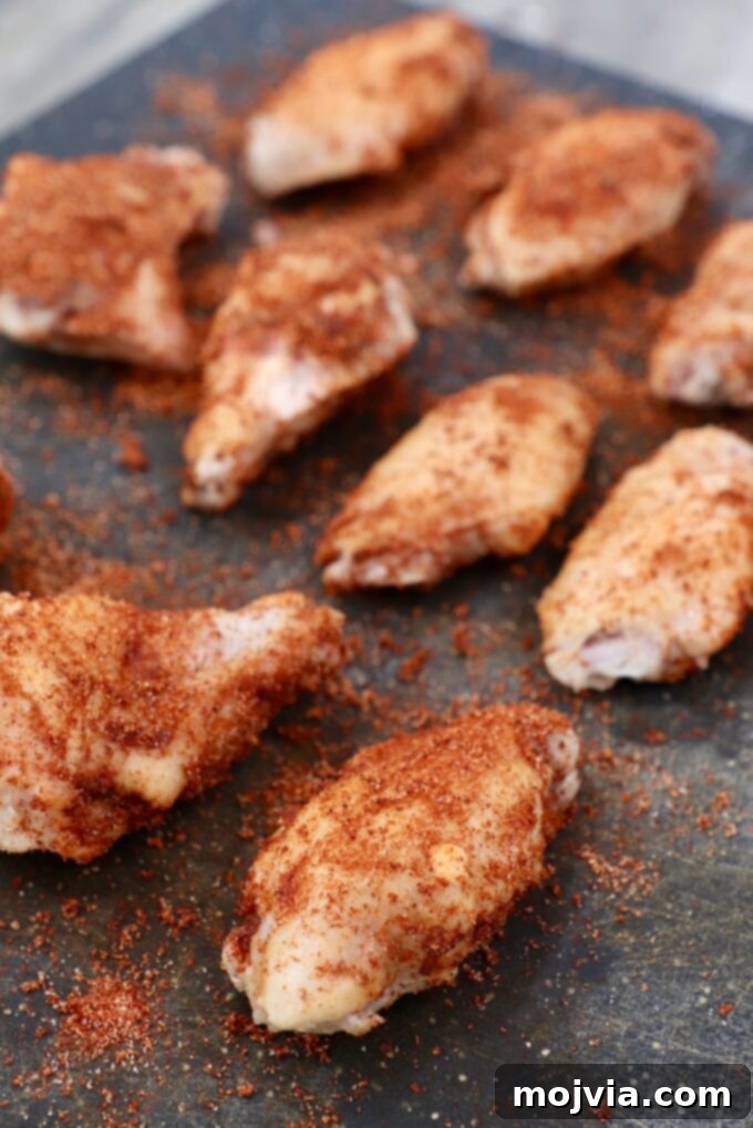 Sous Vide Wings: Crispy, Juicy Perfection 7 seasoned chicken wings on cutting board