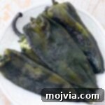 Smoky Roasted Poblanos 11 roasted poblano peppers on plate
