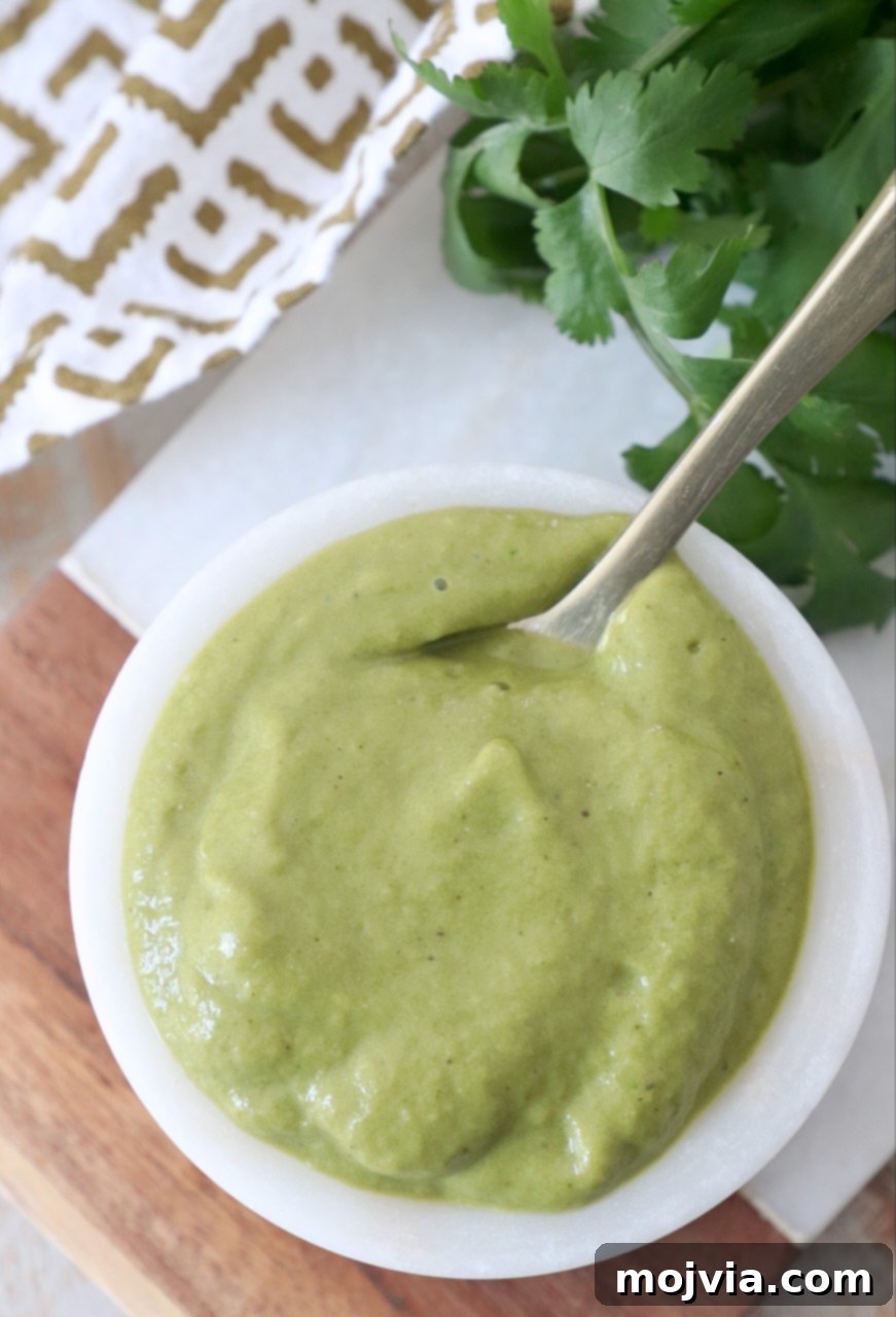 Smoky Poblano Verde 2 poblano sauce in small white bowl with spoon