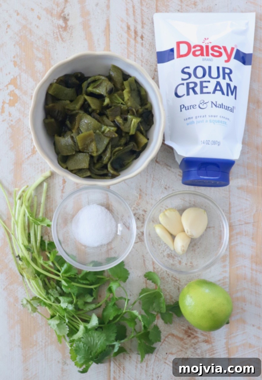 Smoky Poblano Verde 3 ingredients for poblano sauce on white wood cutting board