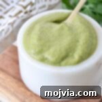 poblano sauce in small bowl with spoon