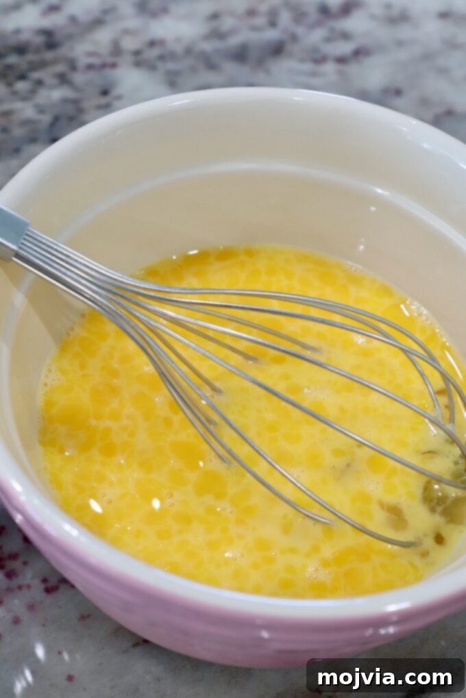 Classic Migas 4 Whisked eggs in a mixing bowl, ready to be cooked for Migas.