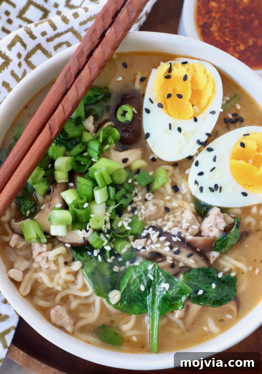 Golden Miso Noodle Perfection 2 A steaming bowl of delicious Miso Ramen, garnished with fresh toppings, with chopsticks resting on the side, ready to be enjoyed.
