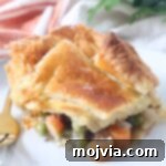 slice of pot pie on plate with fork
