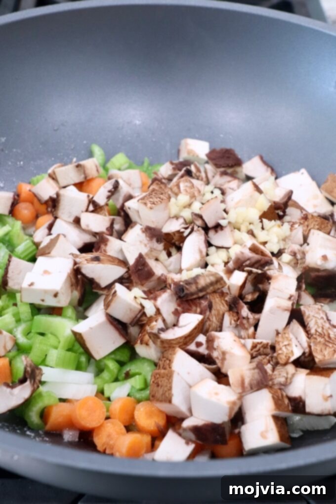 Rustic Vegetable Pot Pie 7 Diced mushrooms and garlic added to the skillet with the softened onions, carrots, and celery