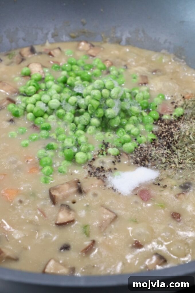 Puff-Pastry Garden Feast 10 Frozen peas and dried thyme stirred into the rich, thick, and creamy vegetable pot pie filling, adding a fresh burst of color and herbaceous flavor.