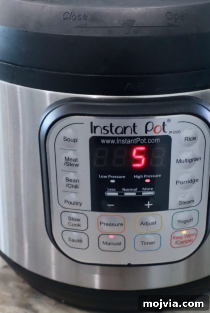 Fluffy Instant Pot Basmati Rice 5 Instant Pot with timer set to 5 minutes
