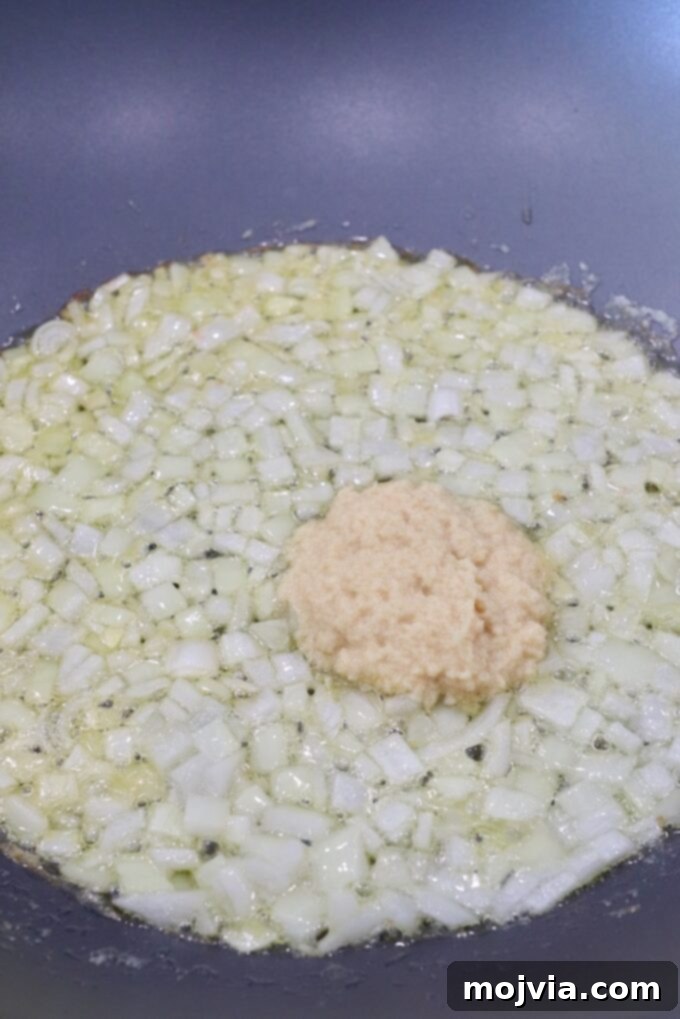 Buttery Paneer Indulgence 4 diced onions in large skillet with garlic ginger paste