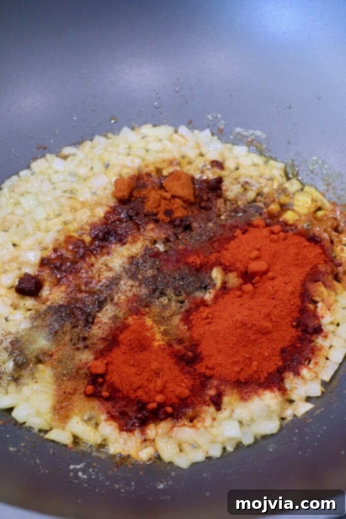 Buttery Paneer Indulgence 5 diced onions in large skillet with spices