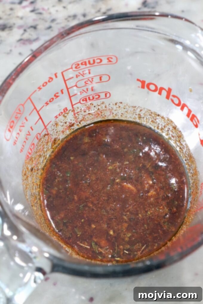 Sizzling Flank Steak Tacos 4 steak marinade in glass measuring cup