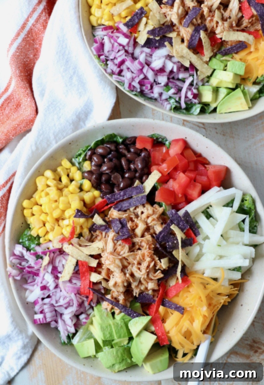 Two bowls of delicious homemade BBQ Chicken Salad with forks