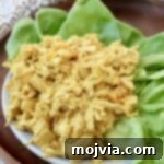 coronation chicken on plate with leaves of lettuce