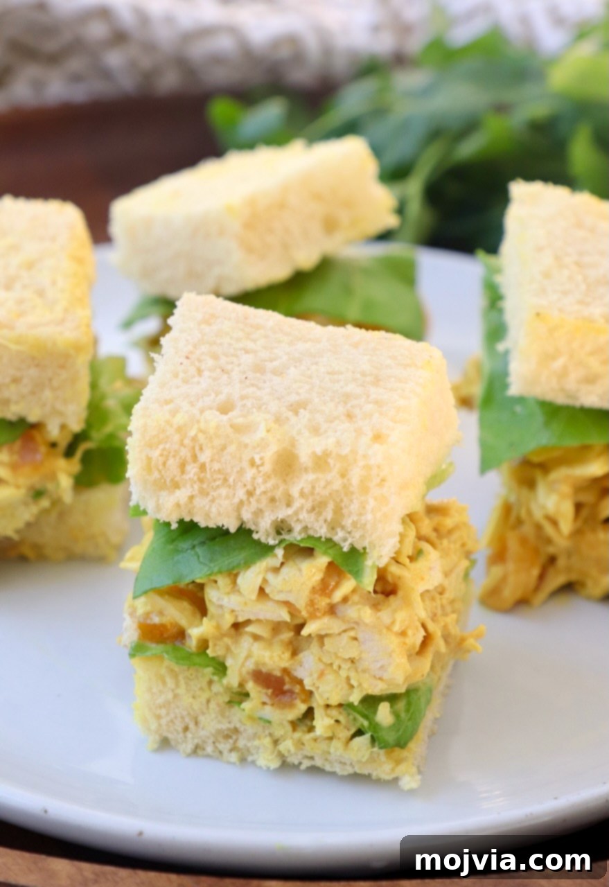Crown Jewel Chicken Salad 10 chicken salad tea sandwiches on a white plate