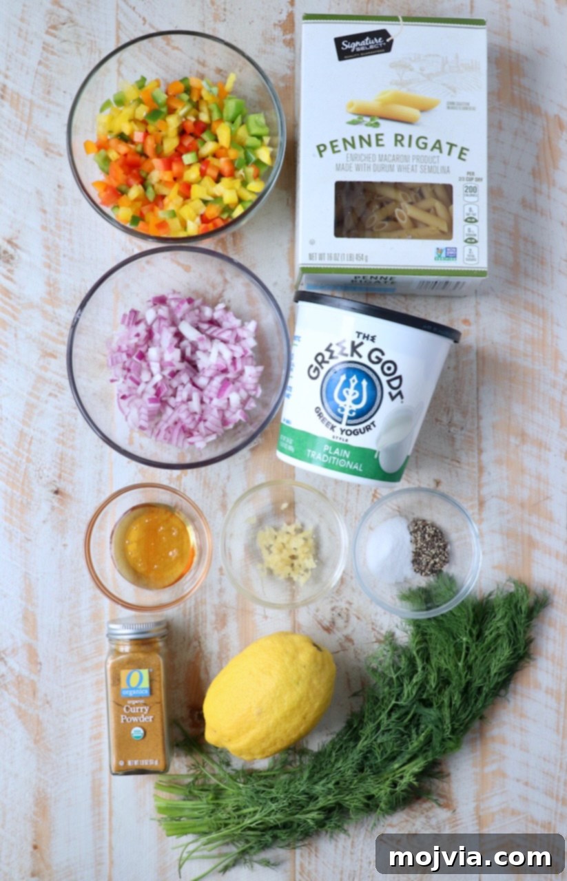 Refreshing Greek Yogurt Pasta Salad 3 Fresh ingredients laid out on a white wooden board for creamy pasta salad