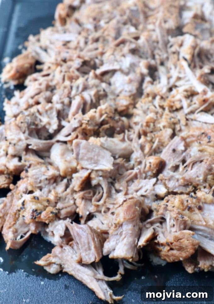 Quick and Tender Pressure Cooker Pork 9 shredded pork shoulder on cutting board