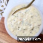 Creamy Garlic Parmesan Indulgence 7 garlic parmesan sauce in bowl with spoon