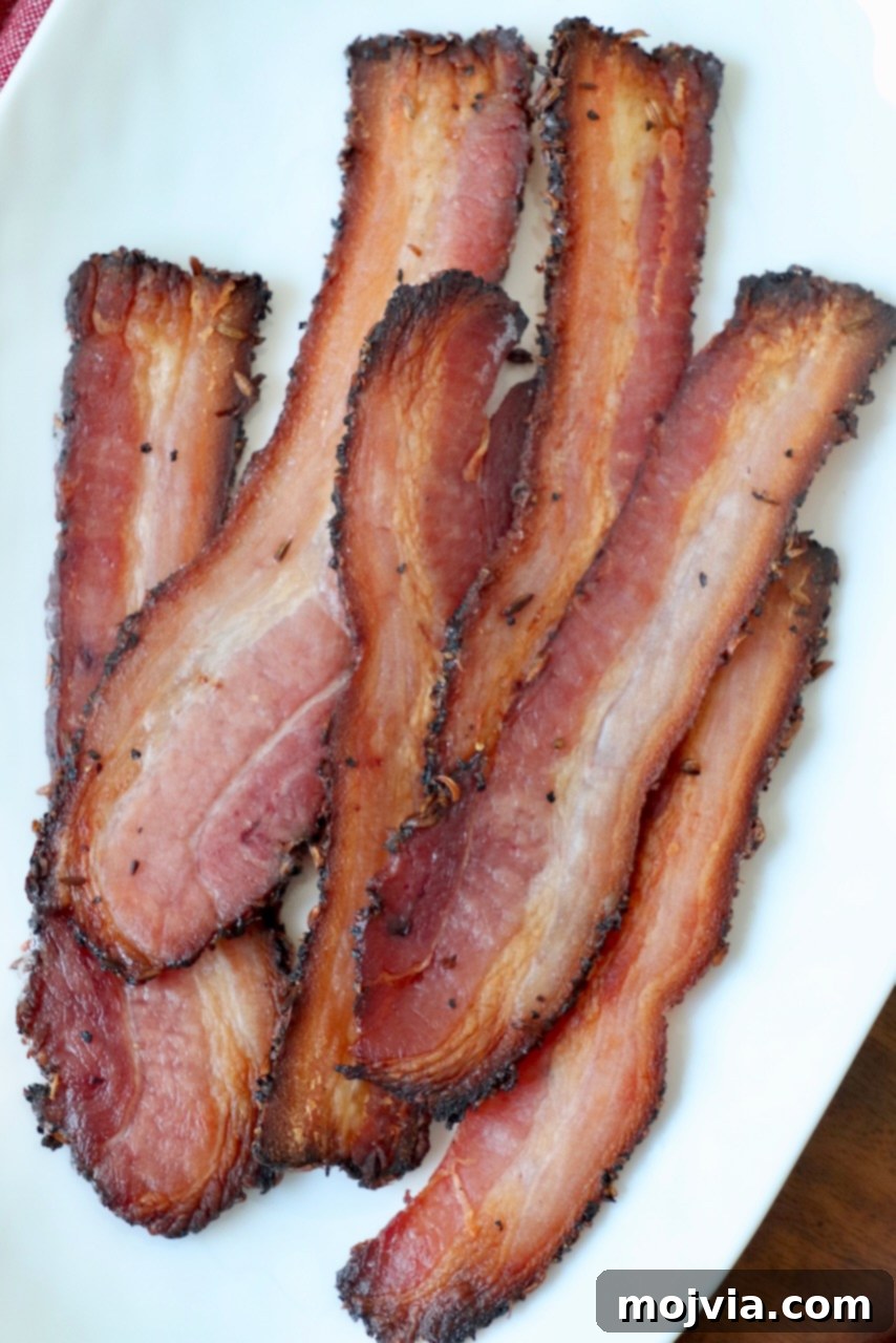 slices of cooked bacon on white plate