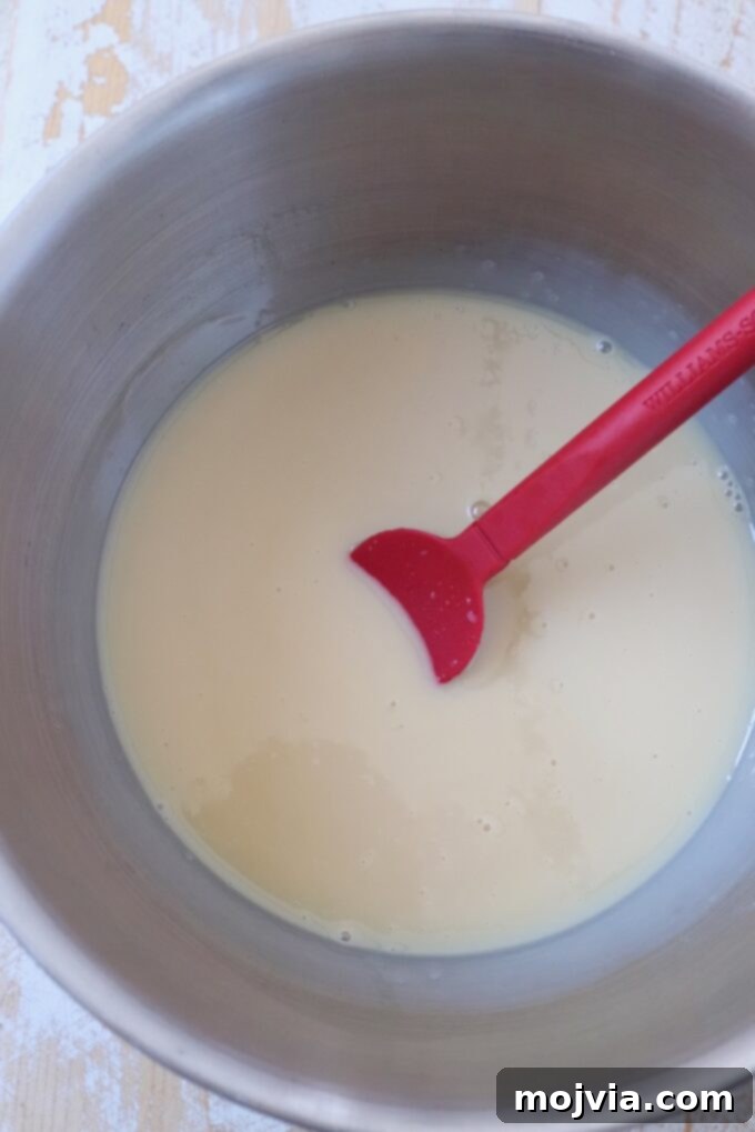 Maple Bacon No-Churn Ice Cream 5 A bowl of sweetened condensed milk, ready to be mixed with other ice cream base ingredients.