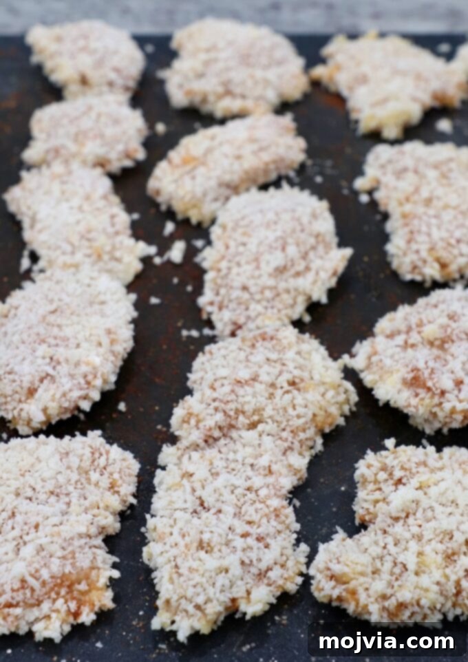 Crispy Boneless Bites 9 pieces of breaded chicken on cutting board