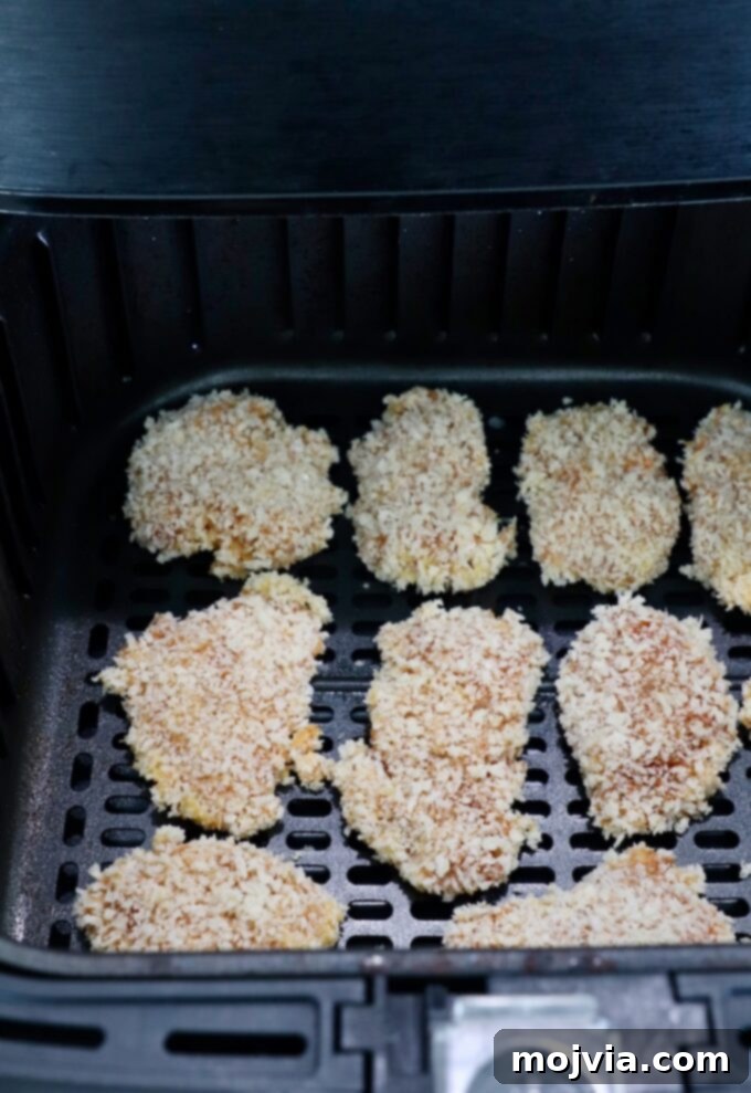 Crispy Boneless Bites 10 pieces of bread chicken in an air fryer basket