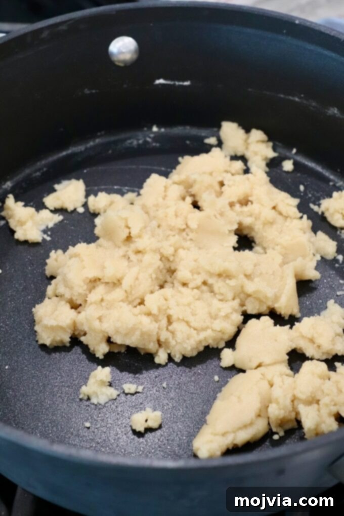 Creamy Greek Comfort Bake 9 A light roux, a buttery flour paste, just formed in a skillet and ready for milk to be added for the béchamel sauce.
