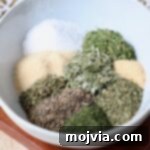 Hellenic Flavor Booster 7 dried herbs and spices separated in bowl