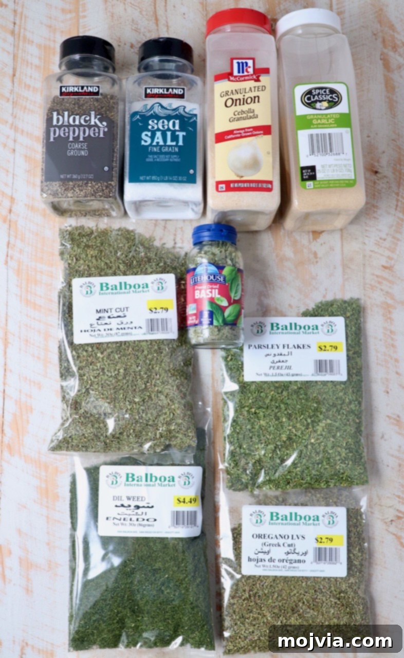 Hellenic Flavor Booster 3 ingredients for Greek seasoning on white wood board