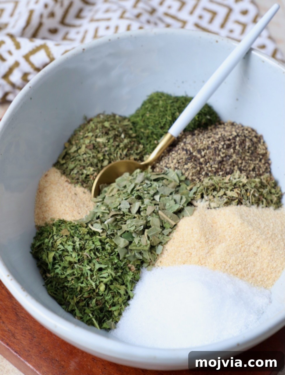 Hellenic Flavor Booster 6 dried herbs and spices separated in bowl with small spoon