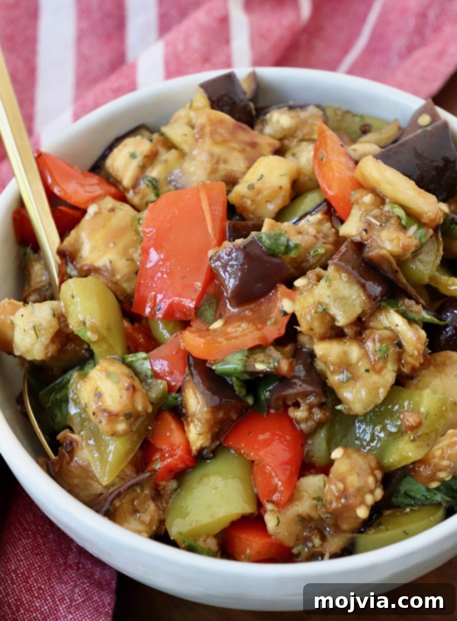 Smoky Eggplant Salad 2 marinated eggplant salad in bowl with spoon