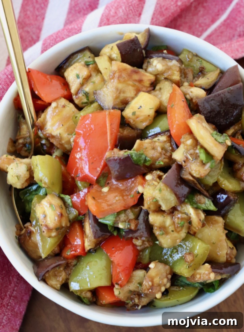 Smoky Eggplant Salad 6 marinated eggplant salad in bowl with spoon