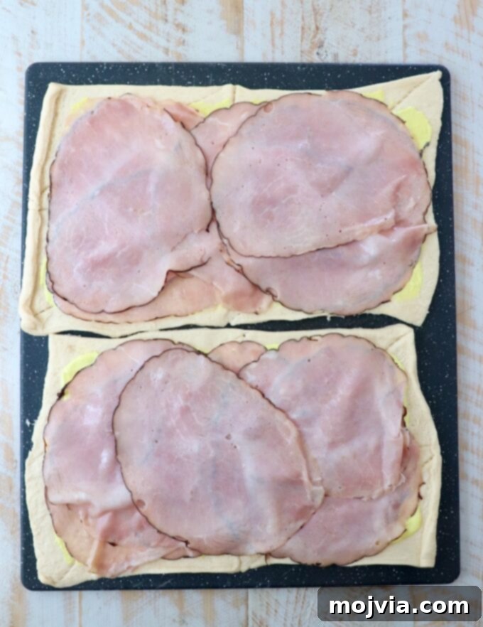 crescent roll dough sheets topped with sliced ham