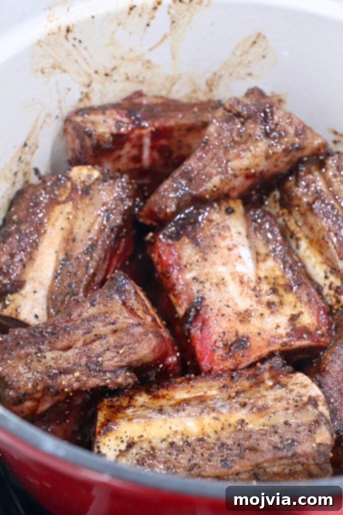 Melt-Off-The-Bone Guinness Short Ribs 6 seared short ribs in dutch oven on stove
