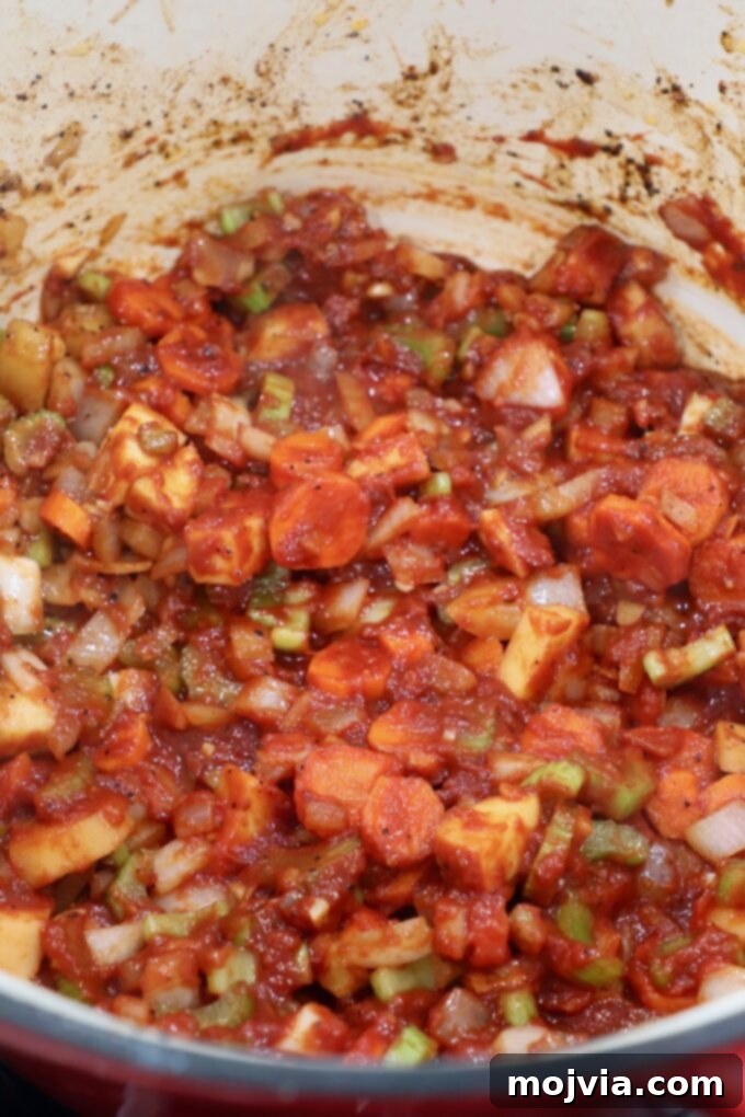 Melt-Off-The-Bone Guinness Short Ribs 8 diced vegetables with tomato paste in dutch oven