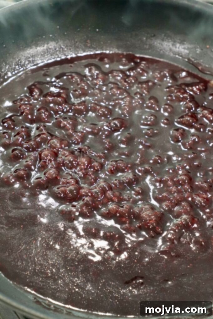 Slow Smoked New York Strip Roast 12 reduced red wine sauce in a skillet
