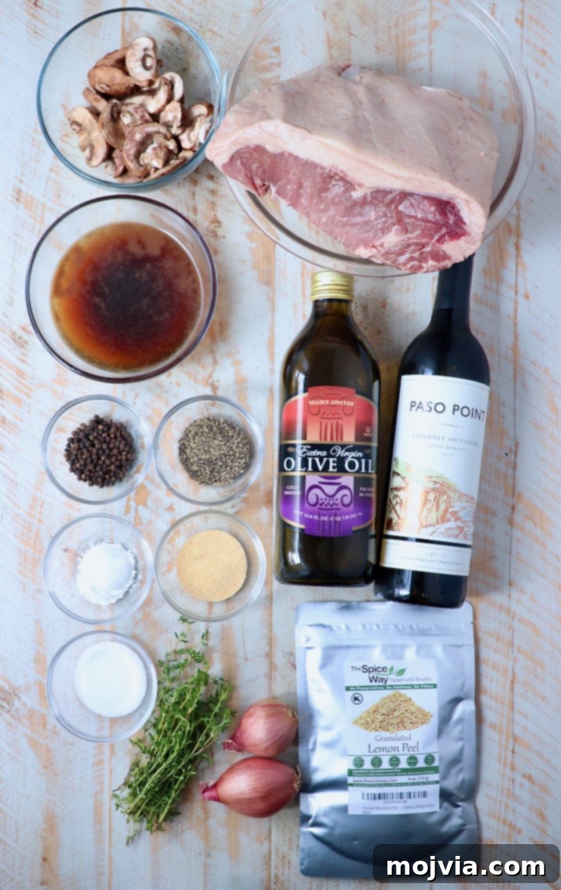 Slow Smoked New York Strip Roast 3 ingredients for smoked new york strip roast on white wood board