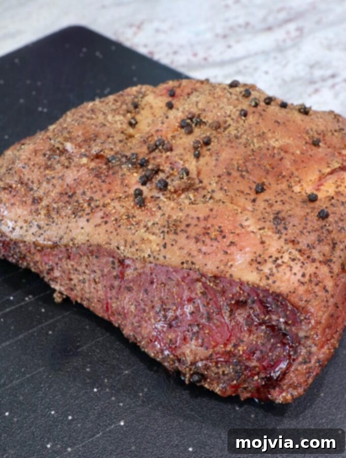 Slow Smoked New York Strip Roast 6 smoked new york strip roast on cutting board