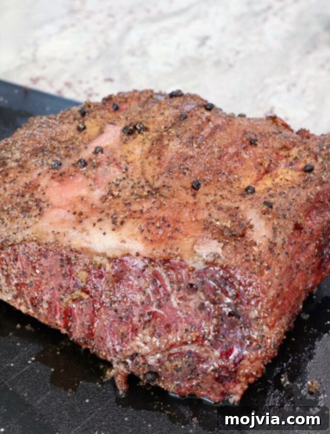 Slow Smoked New York Strip Roast 8 smoked and seared strip roast on cutting board