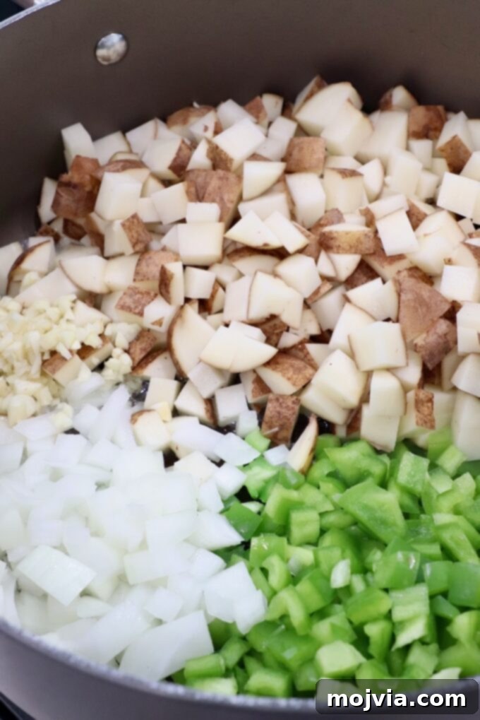 Philly Cheesesteak Skillet 4 diced potatoes, green peppers and onions in large dutch oven