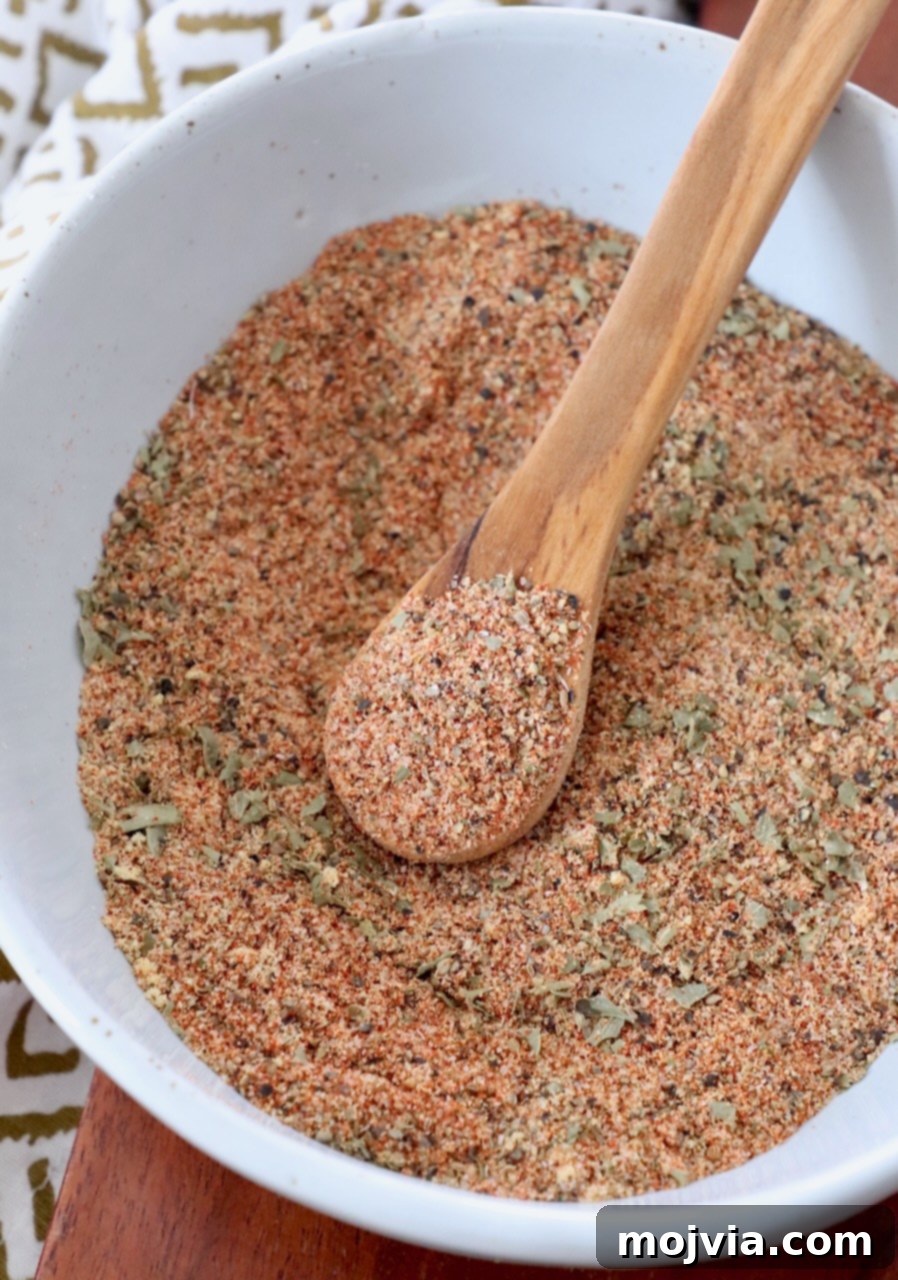 Ultimate Meatloaf Blend 2 Meatloaf seasoning blend in a wooden bowl with a wooden spoon