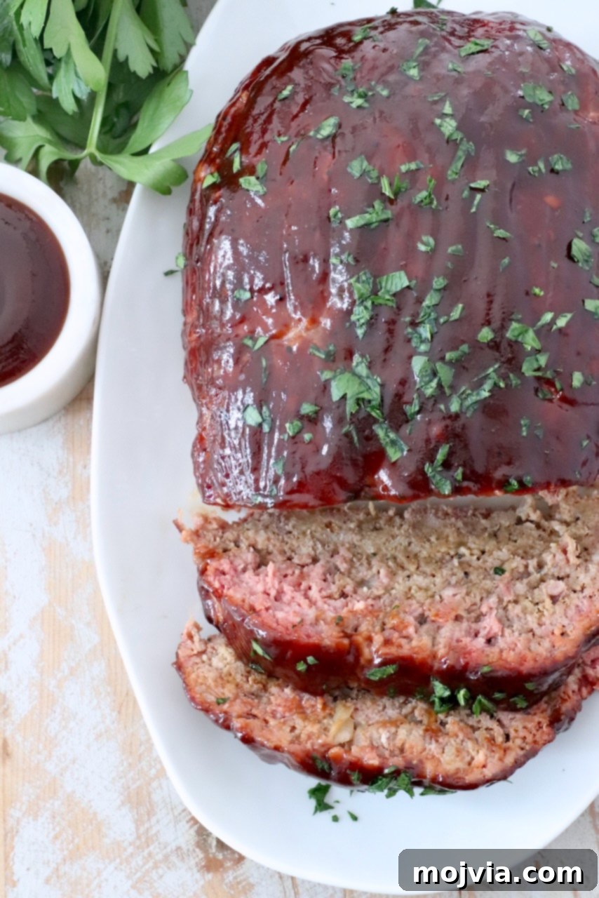 Pitmaster's Smoked Meatloaf 12 smoked, sliced bbq meatloaf on plate, ready to be served