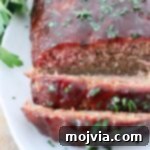 Pitmaster's Smoked Meatloaf 13 sliced, smoked meatloaf on plate