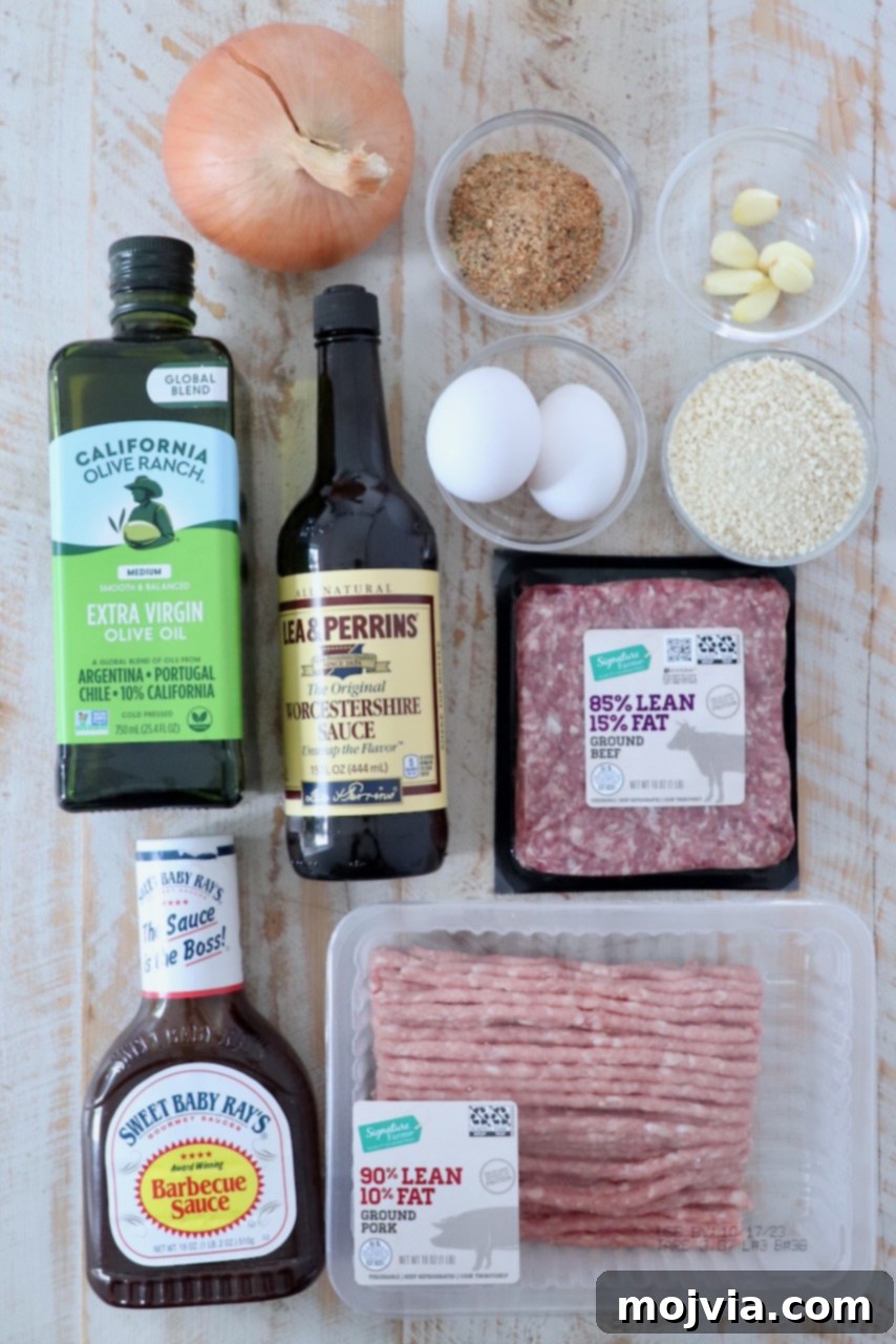 Pitmaster's Smoked Meatloaf 3 ingredients for smoked meatloaf laid out on a white wooden board