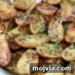 roasted baby potatoes in bowl with fork